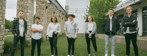 The Refuge worship band poses together for a photo on campus.