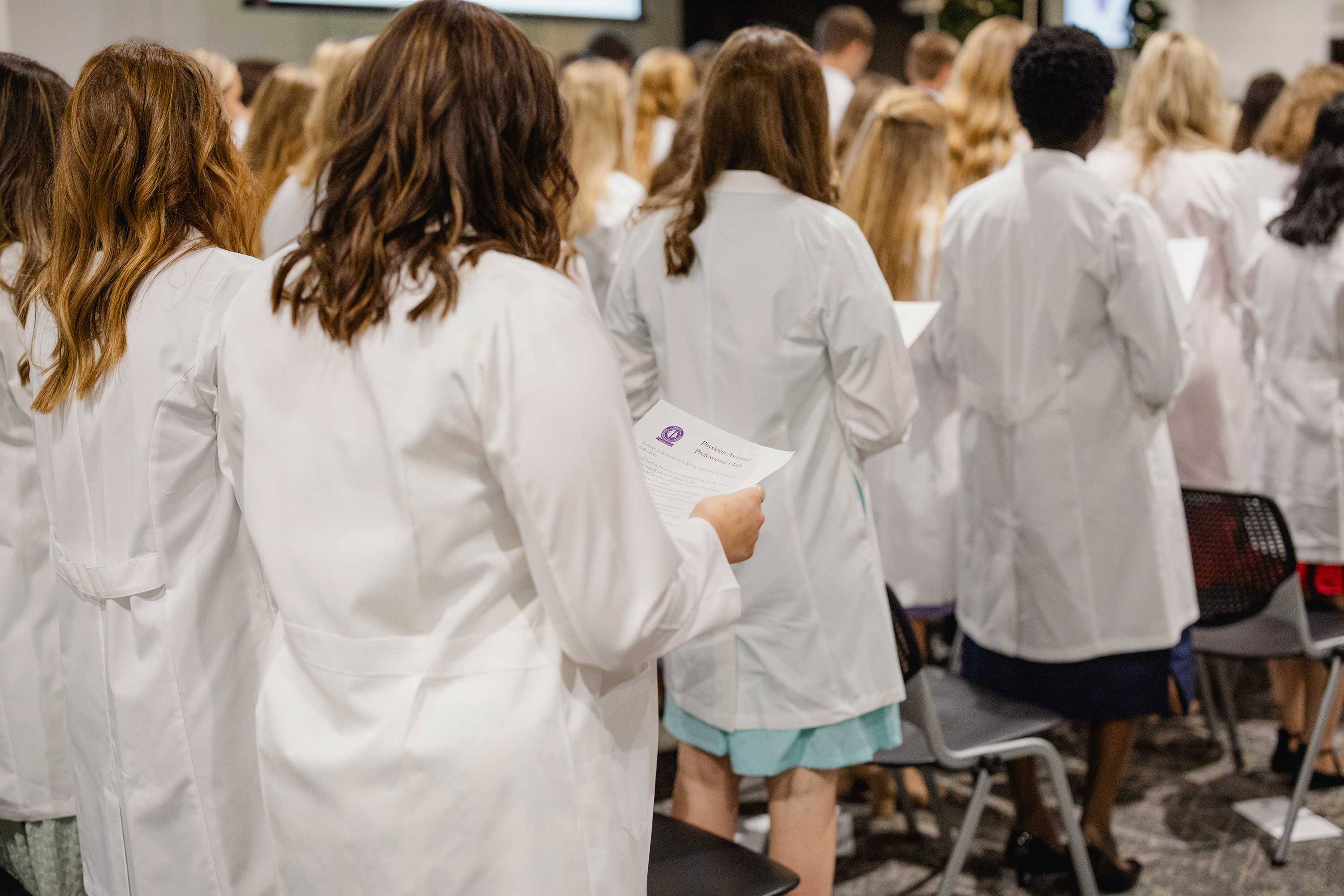 Trevecca's PA students stand at graduation ceremony.