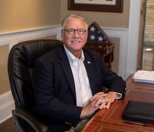 Mayor Randy Carroll sits in his office.